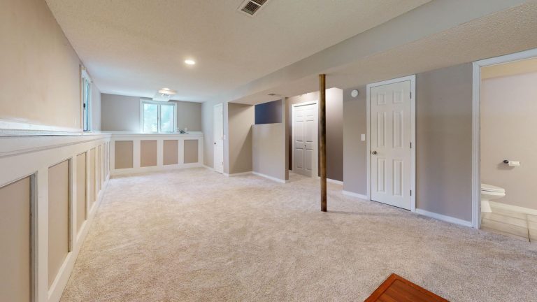 Bright finished basement in an Ohio home ready for new flooring