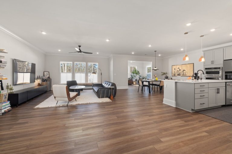Wood flooring running through an open-plan Ohio living room and kitchen