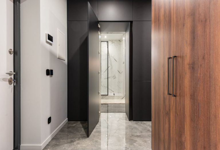 Polished natural stone flooring in a residential entry hallway